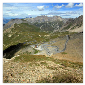 Cabriolet ascending a winding Swiss alpine pass