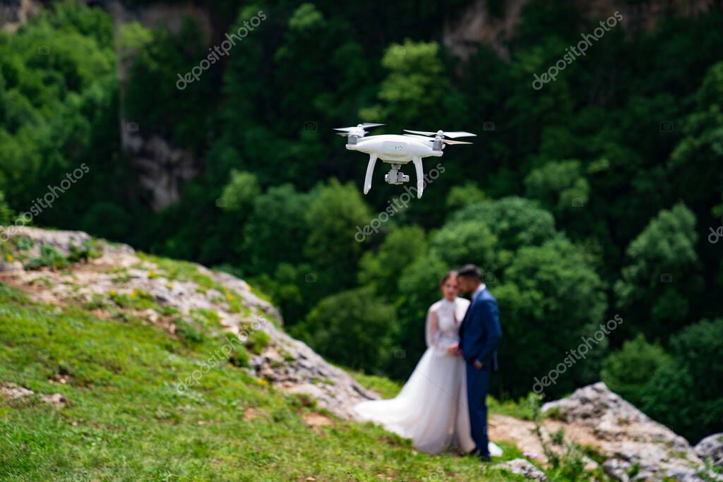 Couple filmed by drone on an alpine road