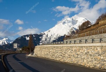 Swiss mountain road with traffic signs