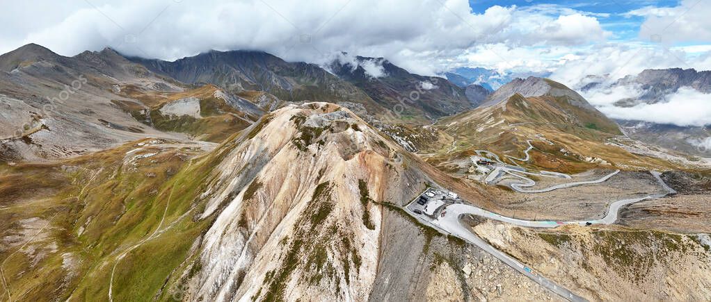 Specialist pointing out a scenic alpine pass route